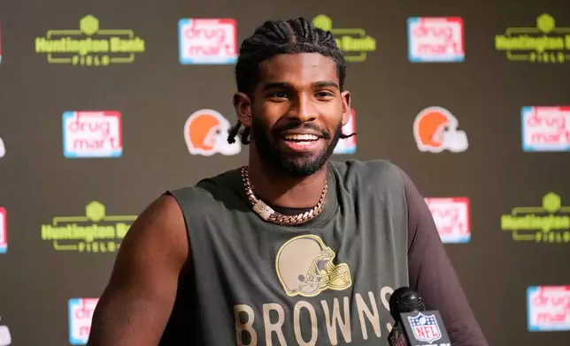 Cleveland Browns quarterback Shedeur Sanders responds to a question during a news conference after an NFL football game against the Baltimore Ravens in Cleveland, Sunday, Nov. 16, 2025. (AP Photo/Sue Ogrocki)