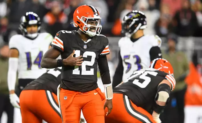 Cleveland Browns quarterback Shedeur Sanders (12) signals at the line of scrimmage in the second half of an NFL football game against the Baltimore Ravens in Cleveland, Sunday, Nov. 16, 2025. (AP Photo/David Richard)