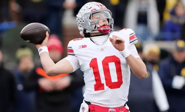 Ohio State quarterback Julian Sayin throws during the first half of an NCAA college football game against Michigan, Saturday, Nov. 29, 2025, in Ann Arbor, Mich. (AP Photo/Ryan Sun)