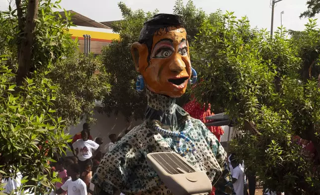 A giant marionette is displayed during an art festival in Bamako, Mali, on Nov. 6, 2025. (AP Photo/Moustapha Diallo)