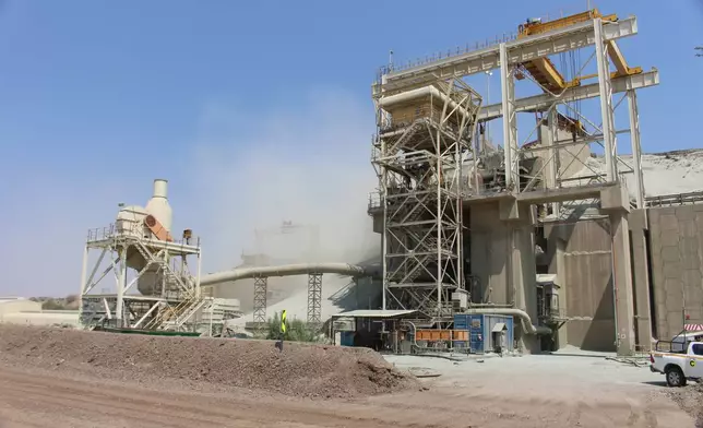 Dust rises from the processing plant at the Orapa open cast mine in Lethakane, Botswana, Sept. 14, 2025. (AP Photo/Sello Motseta)