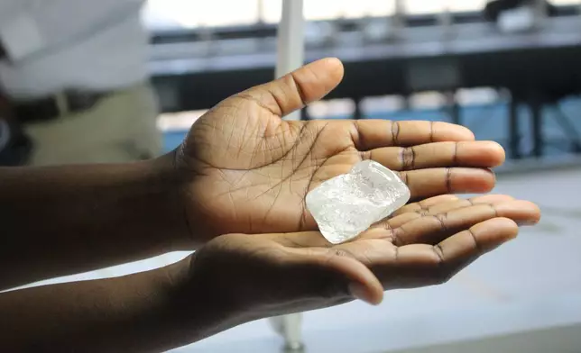 A raw diamond is displayed during a media tour of the Diamond Trading Company in Gaborone, Botswana, Sept. 16, 2025. (AP Photo/Sello Motseta)