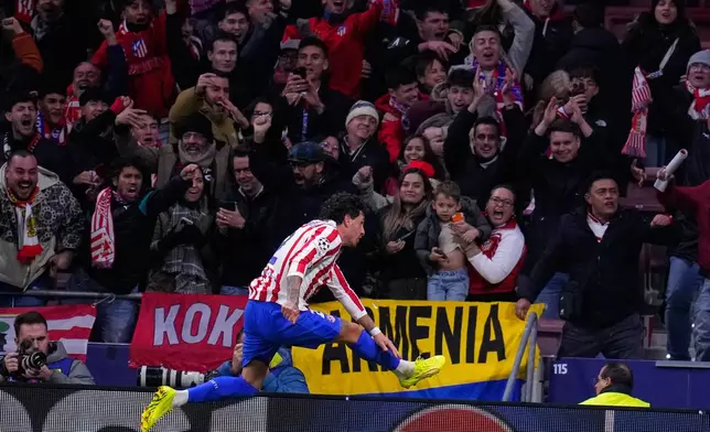 Atletico Madrid's Jose Gimenez celebrates his side's second goal during the Champions League opening phase soccer match between Atletico Madrid and Inter Milan, in Madrid, Spain, Wednesday, Nov. 26, 2025. (AP Photo/Manu Fernandez)