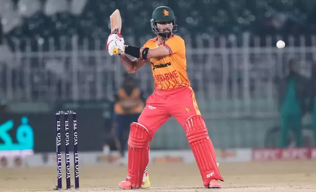 Zimbabwe's Sikandar Raza plays a shot during the tri-series T20 cricket match between Sri Lanka and Zimbabwe, in Rawalpindi, Pakistan, Thursday, Nov. 20, 2025. (AP Photo/Anjum Naveed)