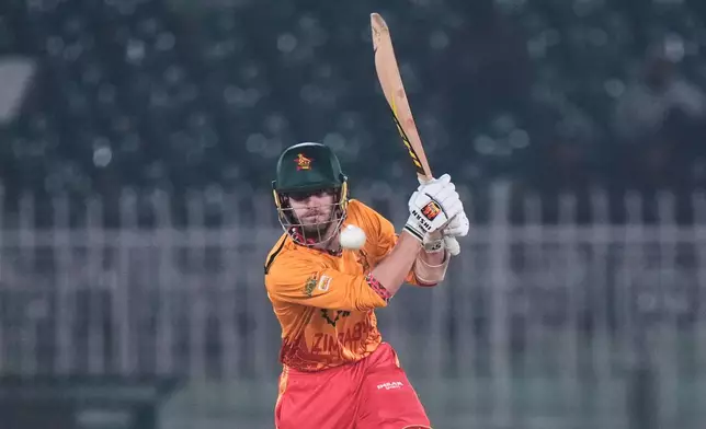 Zimbabwe's Brian Bennett plays a shot during the tri-series T20 cricket match between Sri Lanka and Zimbabwe, in Rawalpindi, Pakistan, Thursday, Nov. 20, 2025. (AP Photo/Anjum Naveed)