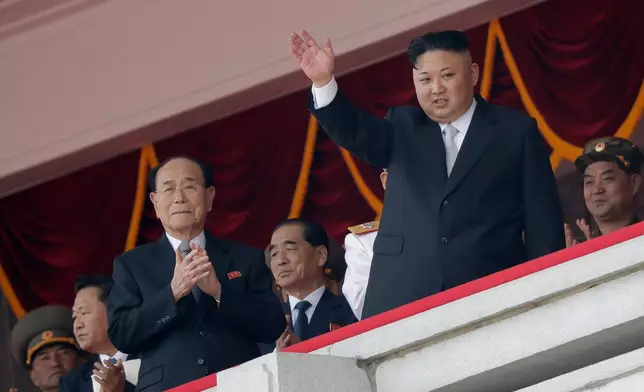 FILE - North Korean leader Kim Jong Un, right, waves while Kim Yong Nam, third left, Choe Ryong Hae, second left, and Pak Pong Ju, center, clap during a military parade April 15, 2017, in Pyongyang, North Korea to celebrate the 105th birth anniversary of Kim Il Sung, the country's late founder and grandfather of current ruler Kim Jong Un. (AP Photo/Wong Maye-E, File)