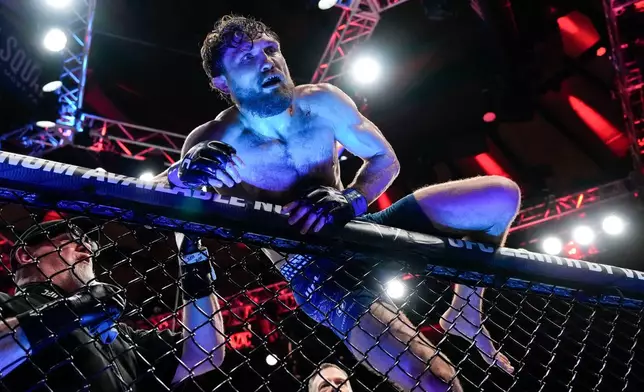 Ethyn Ewing celebrates after defeating Malcolm Wellmaker during a featherweight bout at the UFC 322 mixed martial arts event, Saturday, Nov. 15, 2025, in New York. (AP Photo/Yuki Iwamura)