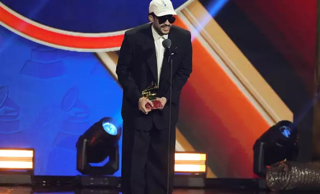 Bad Bunny accepts the award for best urban music album for "DeBí TiRAR MáS FOToS" during the 2025 Latin Grammys on Thursday, Nov. 13, 2025, at MGM Grand in Las Vegas. (AP Photo/Chris Pizzello)
