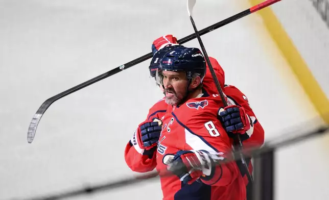 Washington Capitals left wing Alex Ovechkin (8) celebrates his goal during the second period of an NHL hockey game against the Los Angeles Kings, Monday, Nov. 17, 2025, in Washington. (AP Photo/Nick Wass)