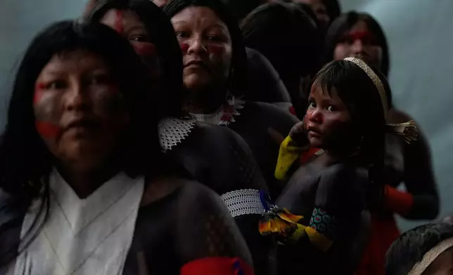 An Indigenous group attends the opening ceremony of the People's Summit offsite from the COP30 U.N. Climate Summit, Wednesday, Nov. 12, 2025, in Belem, Brazil. (AP Photo/Fernando Llano)