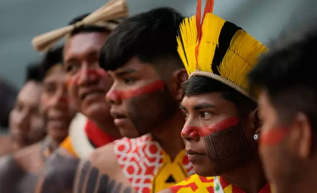 An Indigenous group attends the opening ceremony of the People's Summit offsite from the COP30 U.N. Climate Summit, Wednesday, Nov. 12, 2025, in Belem, Brazil. (AP Photo/Fernando Llano)