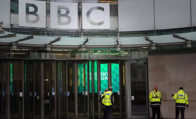 Security guards outside BBC Broadcasting House in London, Tuesday, Nov. 11, 2025. (AP Photo/Kirsty Wigglesworth)