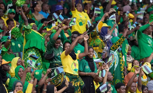 Supporters of the ruling Chama Cha Mapinduzi (Revolutionary Party) sing during the inauguration of Zanzibar President elect Hussein Ali Mwinyi at Amaan Stadium in Zanzibar, Tanzania, Saturday, Nov. 1, 2025. (AP Photo/Brian Inganga)