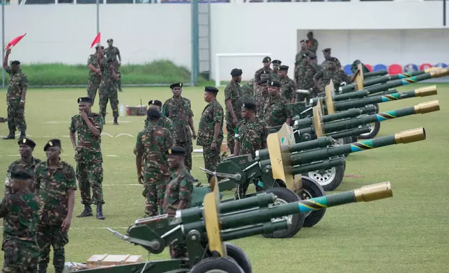 Tanzanian Army fires a 21 gun salute during the inauguration of Zanzibar President elect Hussein Ali Mwinyi of the ruling Chama Cha Mapinduzi (Revolutionary Party) at Amaan Stadium in Zanzibar, Tanzania, Saturday, Nov. 1, 2025. (AP Photo/Brian Inganga)