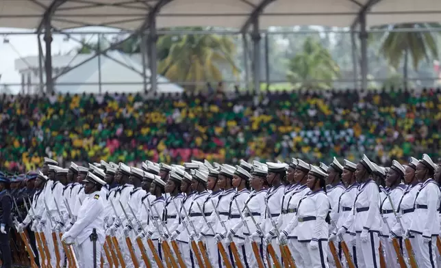 Tanzania Navy soldiers march in formation during the inauguration of Zanzibar President elect Hussein Ali Mwinyi of the ruling Chama Cha Mapinduzi (Revolutionary Party) at Amman Stadium in Zanzibar, Tanzania, Saturday, Nov. 1, 2025. (AP Photo/Brian Inganga)