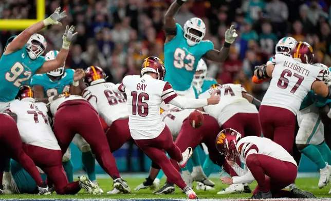 Washington Commanders place kicker Matt Gay (16) misses a field goal attempt to win the game during the second half of an NFL football game between the Washington Commanders and the Miami Dolphins in Madrid, Spain, Sunday, Nov. 16, 2025. (AP Photo/Bernat Armangue)