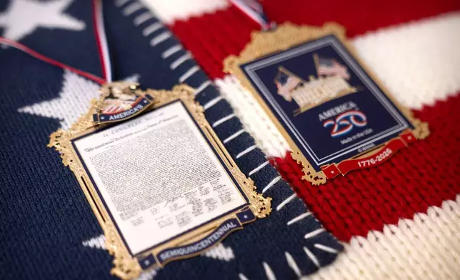 The front and back of a commemorative ornament released by America250 as part of events leading up to the 250th anniversary of the signing of the Declaration of Independence in 1776, is photographed Thursday, Nov. 13, 2025, in Washington. (AP Photo/Mark Schiefelbein)