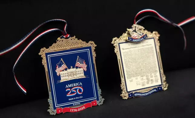 The front and back of a commemorative ornament released by America250 as part of events leading up to the 250th anniversary of the signing of the Declaration of Independence in 1776, is photographed Thursday, Nov. 13, 2025, in Washington. (AP Photo/Mark Schiefelbein)