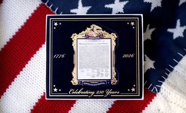 A commemorative ornament released by America250 as part of events leading up to the 250th anniversary of the signing of the Declaration of Independence in 1776, is photographed Thursday, Nov. 13, 2025, in Washington. (AP Photo/Mark Schiefelbein)