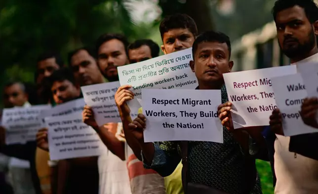 Bangladeshi workers who were employed by Malaysian companies protest in front of the Ministry of Expatriates' Welfare and Overseas Employment demanding unpaid wages, fair compensation and an end to alleged abuse by Malaysian employers, in Dhaka, Bangladesh, Monday, Nov. 10, 2025. (AP Photo/Mahmud Hossain Opu)