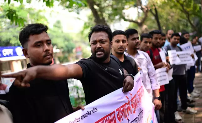Bangladeshi workers who were employed by Malaysian companies protest in front of the Ministry of Expatriates' Welfare and Overseas Employment demanding unpaid wages, fair compensation and an end to alleged abuse by Malaysian employers, in Dhaka, Bangladesh, Monday, Nov. 10, 2025. (AP Photo/Mahmud Hossain Opu)