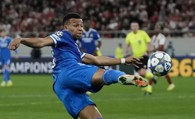 Real Madrid's Kylian Mbappe attempts a shot on goal during the Champions League opening phase soccer match between Olympiacos and Real Madrid in Piraeus port, near Athens, Greece, Wednesday, Nov. 26, 2025. (AP Photo/Thanassis Stavrakis)