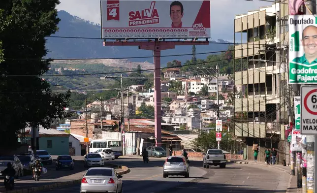 A billboard promoting presidential candidate Salvador Nasralla of the Liberal Party stands in Tegucigalpa, Honduras, Thursday, Nov. 27, 2025, prior to general elections. (AP Photo/Moises Castillo)