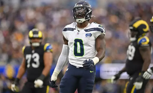 Seattle Seahawks linebacker DeMarcus Lawrence celebrates a false start by the Los Angeles Rams during the second half of an NFL football game Sunday, Nov. 16, 2025, in Inglewood, Calif. (AP Photo/Katie Chin)