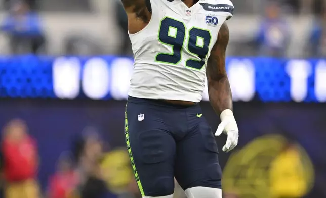 Seattle Seahawks defensive end Leonard Williams celebrates forcing a fourth down during the second half of an NFL football game against the Los Angeles Rams, Sunday, Nov. 16, 2025, in Inglewood, Calif. (AP Photo/Katie Chin)