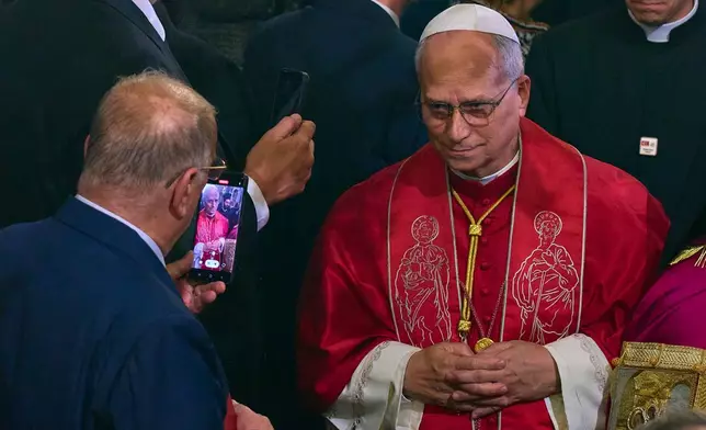 Pope Leo XIV leaves at the end of the Doxology in the Patriarchal Church of Saint George in Istanbul, Turkey, Saturday, Nov. 29, 2025. (AP Photo/Domenico Stinellis)