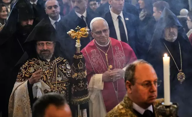Pope Leo XIV and the Armenian Patriarch of Constantinople Archbishop Sahag II Mashalian arrive to celebrate a liturgy in the Armenian Apostolic Cathedral of Istanbul, Turkey, Sunday, Nov. 30, 2025. (AP Photo/Domenico Stinellis)