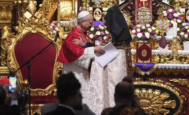 Pope Leo XIV and the Armenian Patriarch of Constantinople Archbishop Sahag II Mashalian celebrate a liturgy in the Armenian Apostolic Cathedral of Istanbul, Turkey, Sunday, Nov. 30, 2025. (AP Photo/Domenico Stinellis)