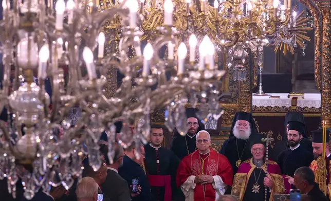 Pope Leo XIV and Ecumenical Patriarch Bartholomew I, right, participate into the Doxology in the Patriarchal Church of Saint George in Istanbul, Turkey, Saturday, Nov. 29, 2025. (AP Photo/Domenico Stinellis)