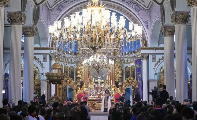 Pope Leo XIV and the Armenian Patriarch of Constantinople Archbishop Sahag II Mashalian celebrate a liturgy in the Armenian Apostolic Cathedral of Istanbul, Turkey, Sunday, Nov. 30, 2025. (AP Photo/Domenico Stinellis)