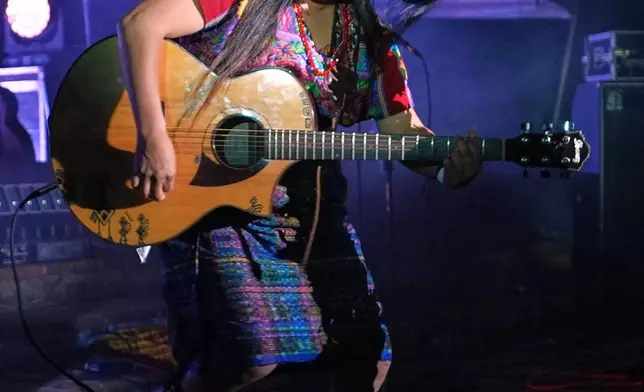 FILE - Mayan Kaqchikel singer-songwriter Sara Curruchich performs in Antigua, Guatemala, Nov. 20, 2025. (AP Photo/Moises Castillo, File)