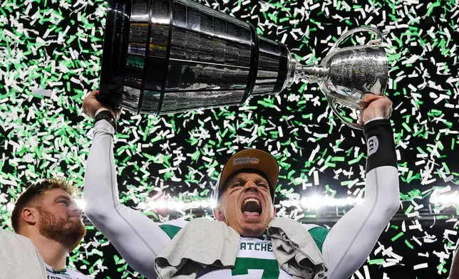 Saskatchewan Roughriders quarterback Trevor Harris (7) celebrates his team's win over the Montreal Alouettes in the CFL Grey Cup football game in Winnipeg, Manitoba, Sunday, Nov. 16, 2025. (Frank Gunn/The Canadian Press via AP)