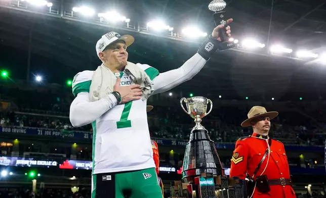 Saskatchewan Roughriders quarterback Trevor Harris (7) celebrates the team's win over the Montreal Alouettes in the CFL Grey Cup football game in Winnipeg, Manitoba, Sunday, Nov. 16, 2025. (Frank Gunn/The Canadian Press via AP)