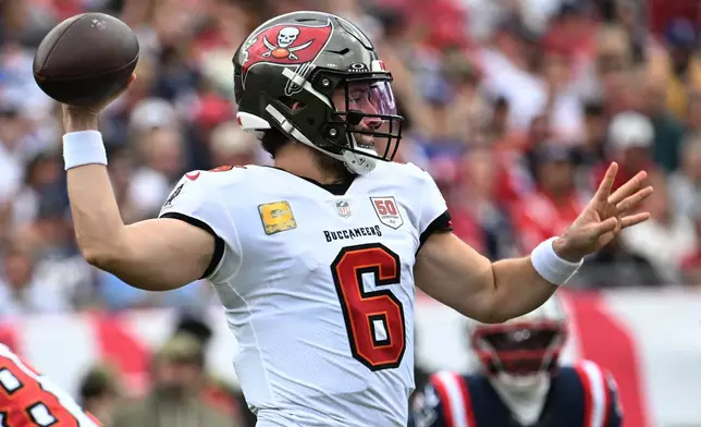Tampa Bay Buccaneers quarterback Baker Mayfield (6) throws against the New England Patriots during the first half of an NFL football game Sunday, Nov. 9, 2025, in Tampa, Fla. (AP Photo/Jason Behnken)