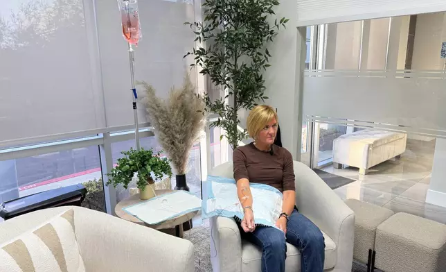 Andrea Steinbrenner receives an IV infusion at Pure Alchemy Wellness, Tuesday, Nov. 11, 2025, in Chula Vista, Calif. (AP Photo/Javier Arciga)
