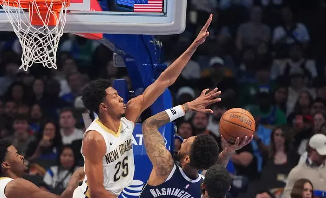 Dallas Mavericks forward P.J. Washington (25) shoots against New Orleans Pelicans forward Trey Murphy III (25) during the first half of an NBA Cup basketball game in Dallas, Friday, Nov. 21, 2025. (AP Photo/LM Otero)