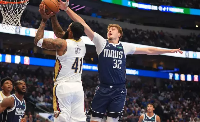 New Orleans Pelicans guard Saddiq Bey (41) shoots against Dallas Mavericks forward Cooper Flagg (32) during the first half of an NBA Cup basketball game in Dallas, Friday, Nov. 21, 2025. (AP Photo/LM Otero)