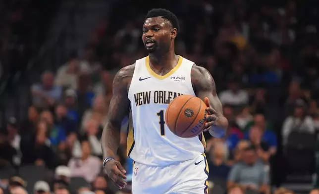 New Orleans Pelicans forward Zion Williamson dribbles the ball during the first half of an NBA Cup basketball game against the Dallas Mavericks in Dallas, Friday, Nov. 21, 2025. (AP Photo/LM Otero)