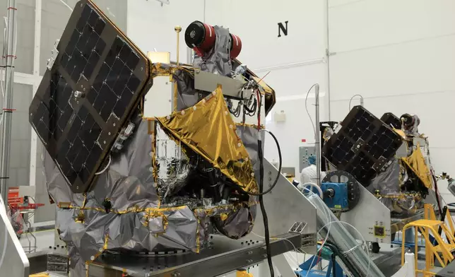 In this image provided by NASA, the agency's identical Mars orbiters, named Escapade (Escape and Plasma Acceleration and Dynamics Explorers) are inspected and processed at the Astrotech Space Operations Facility near the agency’s Kennedy Space Center in Cape Canaveral, Fla., Thursday, Aug. 22, 2025. (Kim Shiflett/NASA via AP)