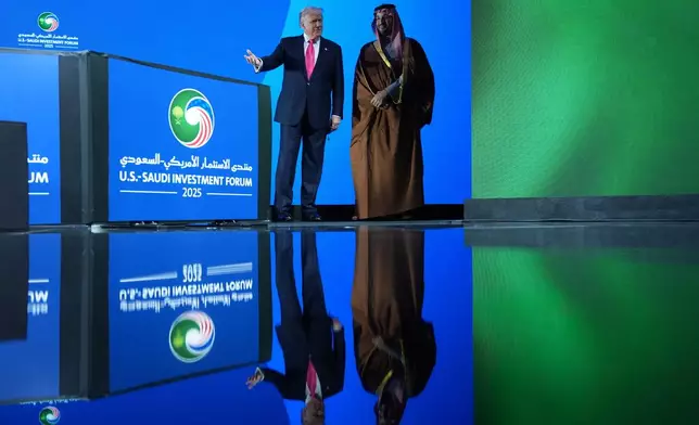 President Donald Trump walks on stage during the Saudi Investment Forum with Saudi Arabia's Crown Prince Mohammed bin Salman at the Kennedy Center, Wednesday, Nov. 19, 2025, in Washington. (AP Photo/Evan Vucci)