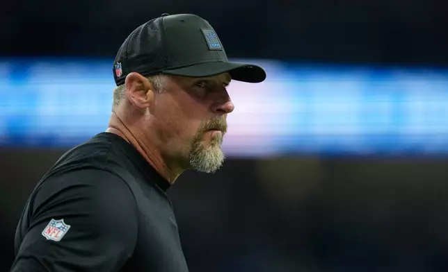 Detroit Lions head coach Dan Campbell stands on the field before an NFL football game against the Minnesota Vikings Sunday, Nov. 2, 2025, in Detroit. (AP Photo/Ryan Sun)