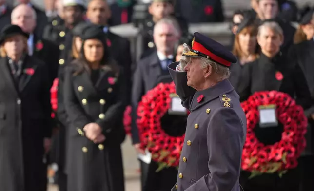 Britain's King Charles III salutes as he attends the Remembrance Sunday Service at the Cenotaph in London, Sunday, Nov. 9, 2025.(AP Photo/Alastair Grant, Pool)