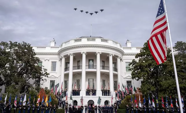 Military jets fly over the White House as President Donald Trump welcomes Saudi Arabia's Crown Prince Mohammed bin Salman, Tuesday, Nov. 18, 2025, in Washington. (AP Photo/Mark Schiefelbein)