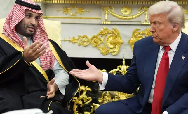 President Donald Trump meets Saudi Arabia's Crown Prince Mohammed bin Salman in the Oval Office of the White House, Tuesday, Nov. 18, 2025, in Washington. (AP Photo/Evan Vucci)