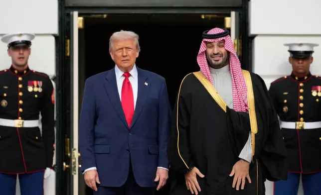 President Donald Trump welcomes Saudi Arabia's Crown Prince Mohammed bin Salman to the White House, Tuesday, Nov. 18, 2025, in Washington. (AP Photo/Mark Schiefelbein)