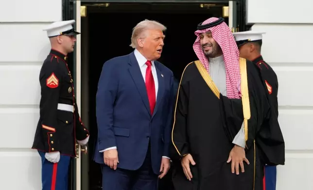 President Donald Trump welcomes Saudi Arabia's Crown Prince Mohammed bin Salman to the White House, Tuesday, Nov. 18, 2025, in Washington. (AP Photo/Mark Schiefelbein)